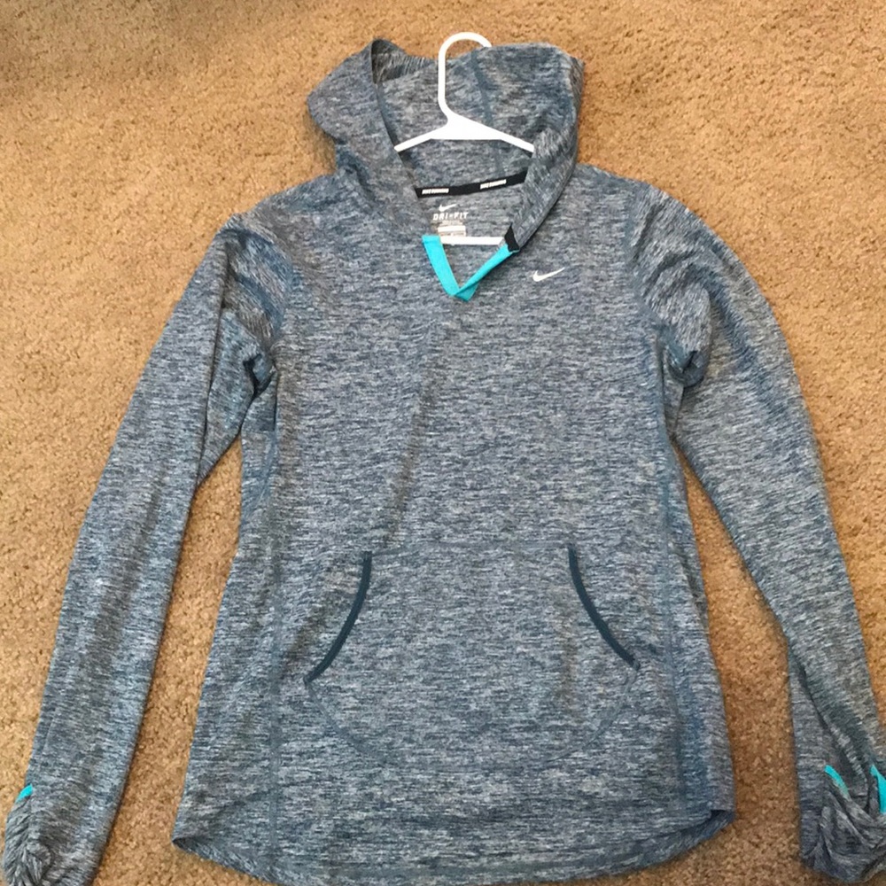 Nike pullover with pockets and a hood.
